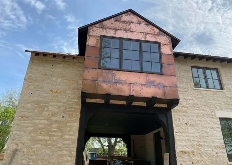 Copper metal panel facade on a stone building for Skylight Installation in Whittier